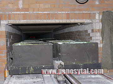 Production of foam glass slab in a continuous furnace